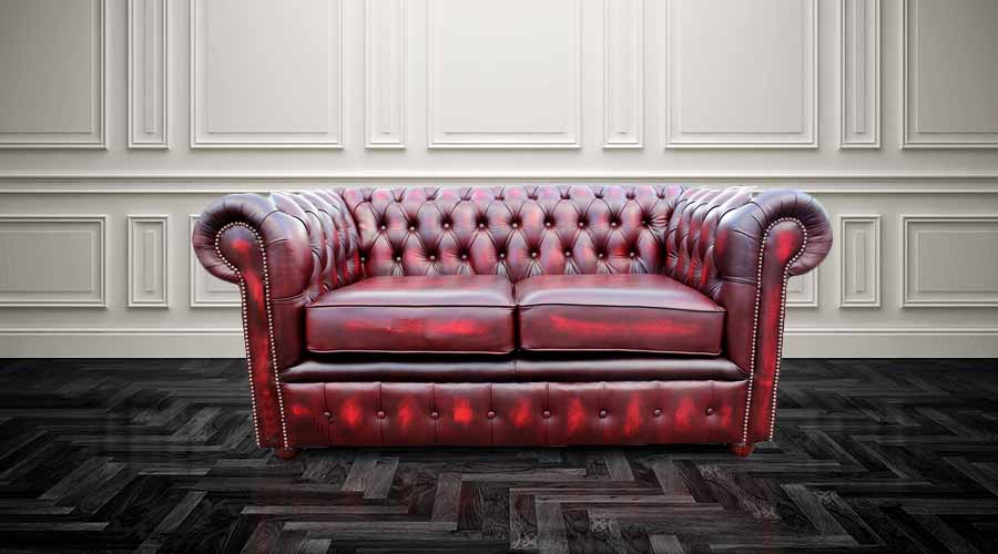 Product photograph of Chesterfield 2 Seater Antique Oxblood Red Leather Sofa Settee In Classic Style from Chesterfield Sofas