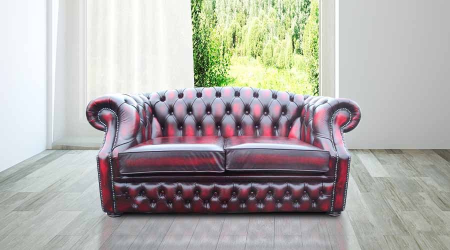 Product photograph of Chesterfield 2 Seater Antique Oxblood Red Leather Sofa Bespoke In Buckingham Style from Chesterfield Sofas