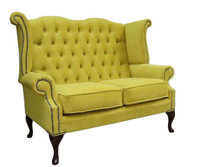 Product photograph of Chesterfield 2 Seater High Back Sofa Amalfi Buttercup Yellow Velvet Fabric In Queen Anne Style from Chesterfield Sofas.