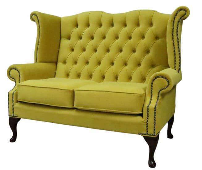 Product photograph of Chesterfield 2 Seater High Back Sofa Amalfi Buttercup Yellow Velvet Fabric In Queen Anne Style from Chesterfield Sofas.