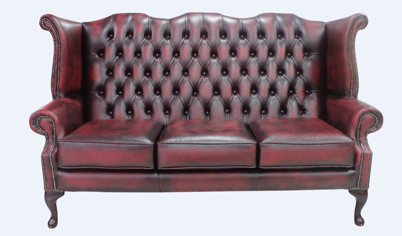 Product photograph of Chesterfield 3 Seater High Back Wing Sofa Antique Oxblood Red Leather In Queen Anne Style from Chesterfield Sofas