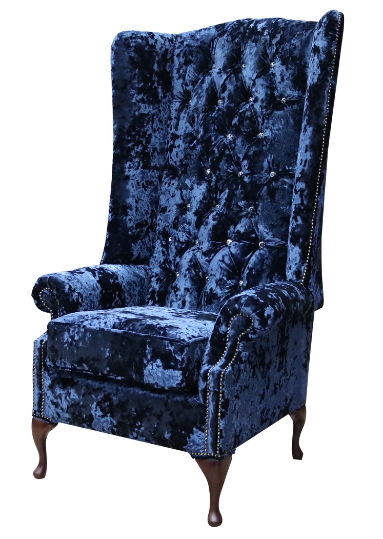 Product photograph of Chesterfield 5ft High Back Wing Chair Lustro Sapphire Blue Velvet Fabric Bespoke In Soho Style from Chesterfield Sofas.