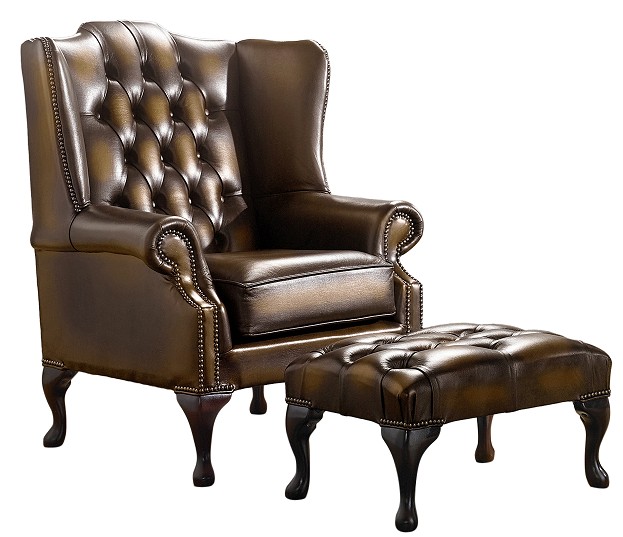 Product photograph of Chesterfield Flat Wing Chair Footstool Antique Gold Leather In Mallory Style from Chesterfield Sofas