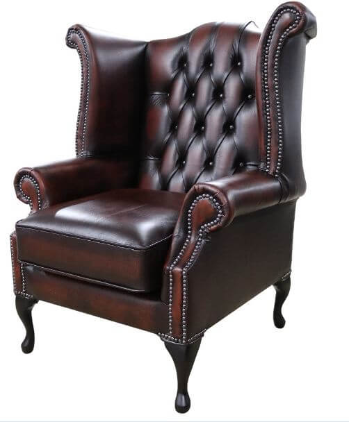 Product photograph of Chesterfield Georgian Wing Chair Antique Rust Leather In Queen Anne Style from Chesterfield Sofas.