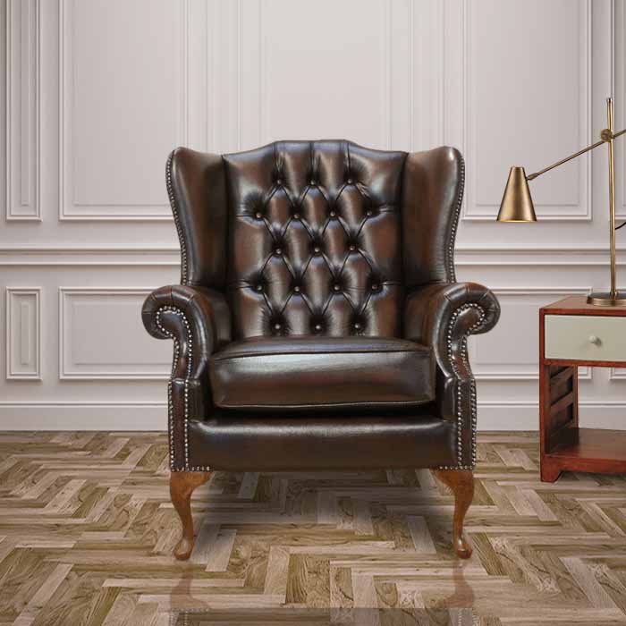Product photograph of Chesterfield High Back Wing Chair Antique Brown Real Leather Bespoke In Mallory Style from Chesterfield Sofas