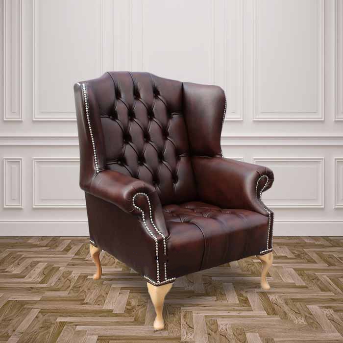 Product photograph of Chesterfield High Back Wing Chair Buttoned Seat Antique Brown Leather In Mallory Style from Chesterfield Sofas