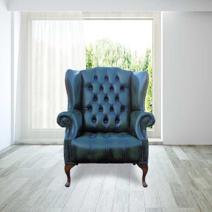 Product photograph of Chesterfield High Back Wing Chair Buttoned Seat Antique Green Leather In Mallory Style from Chesterfield Sofas