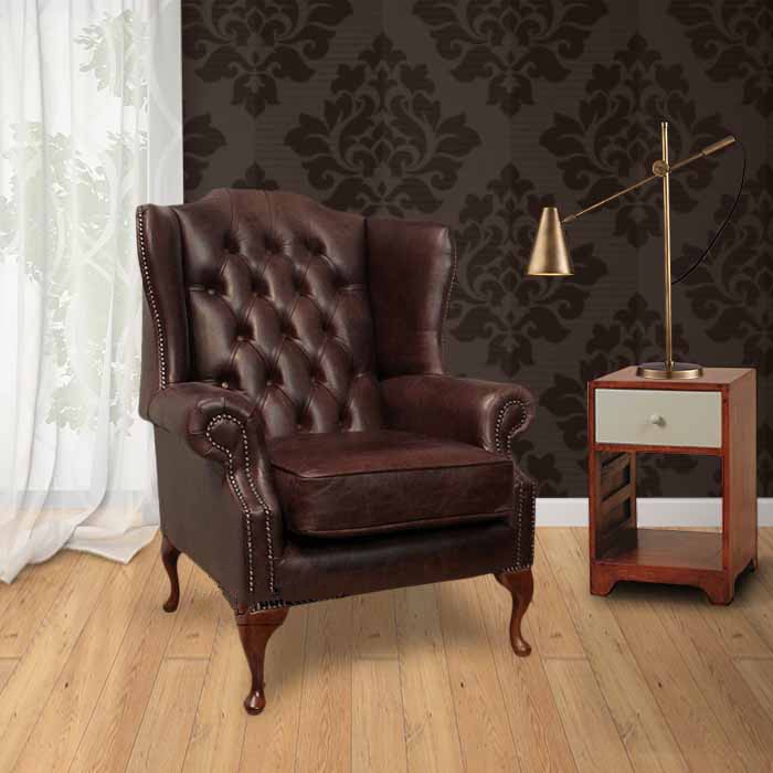 Product photograph of Chesterfield High Back Wing Chair Old English Dark Brown Leather In Mallory Style from Chesterfield Sofas