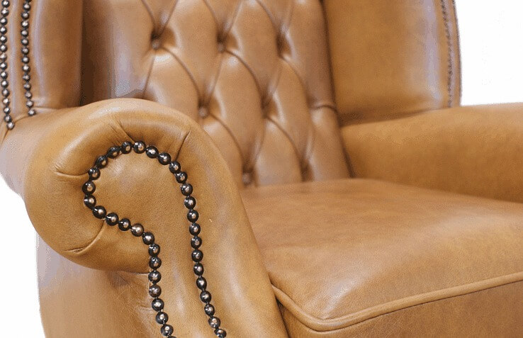 Product photograph of Chesterfield High Back Wing Chair Old English Tan Leather In Queen Anne Style from Chesterfield Sofas.