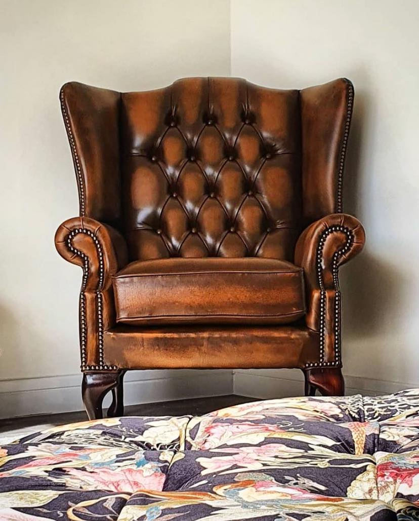 Product photograph of Chesterfield High Back Wing Chair Antique Tan Real Leather Bespoke In Mallory Style from Chesterfield Sofas.