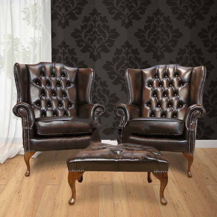 Product photograph of Chesterfield Pair High Back Wing Chair Footstool Antique Brown Leather In Mallory Style from Chesterfield Sofas