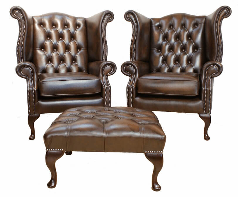 Product photograph of Chesterfield Pair High Back Wing Chair Footstool Antique Brown Leather In Queen Anne Style from Chesterfield Sofas.