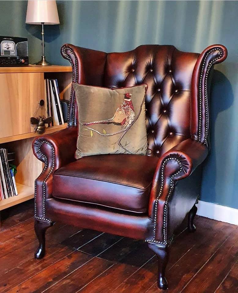 Product photograph of Chesterfield High Back Wing Chair Antique Oxblood Red Real Leather In Queen Anne Style from Chesterfield Sofas.