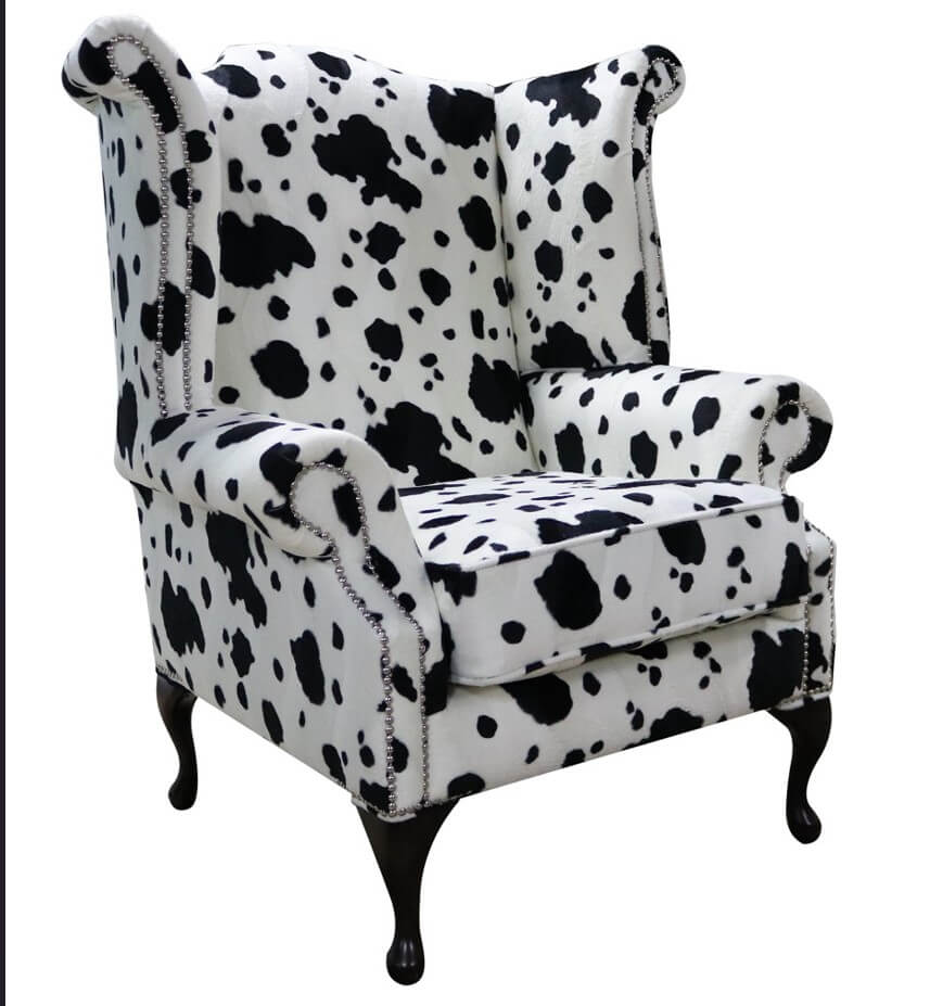 Product photograph of Chesterfield Saxon High Back Wing Chair Black Cow Animal Print Fabric In Queen Anne Style from Chesterfield Sofas.