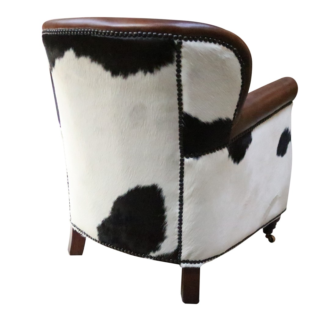 Product photograph of Vintage Black Cow Armchair Distressed Brown Real Leather from Chesterfield Sofas.