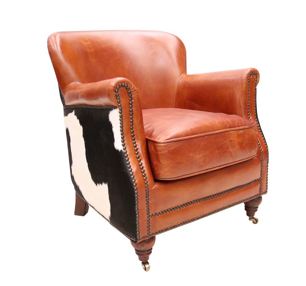 Product photograph of Vintage Black Cow Armchair Distressed Tan Real Leather from Chesterfield Sofas